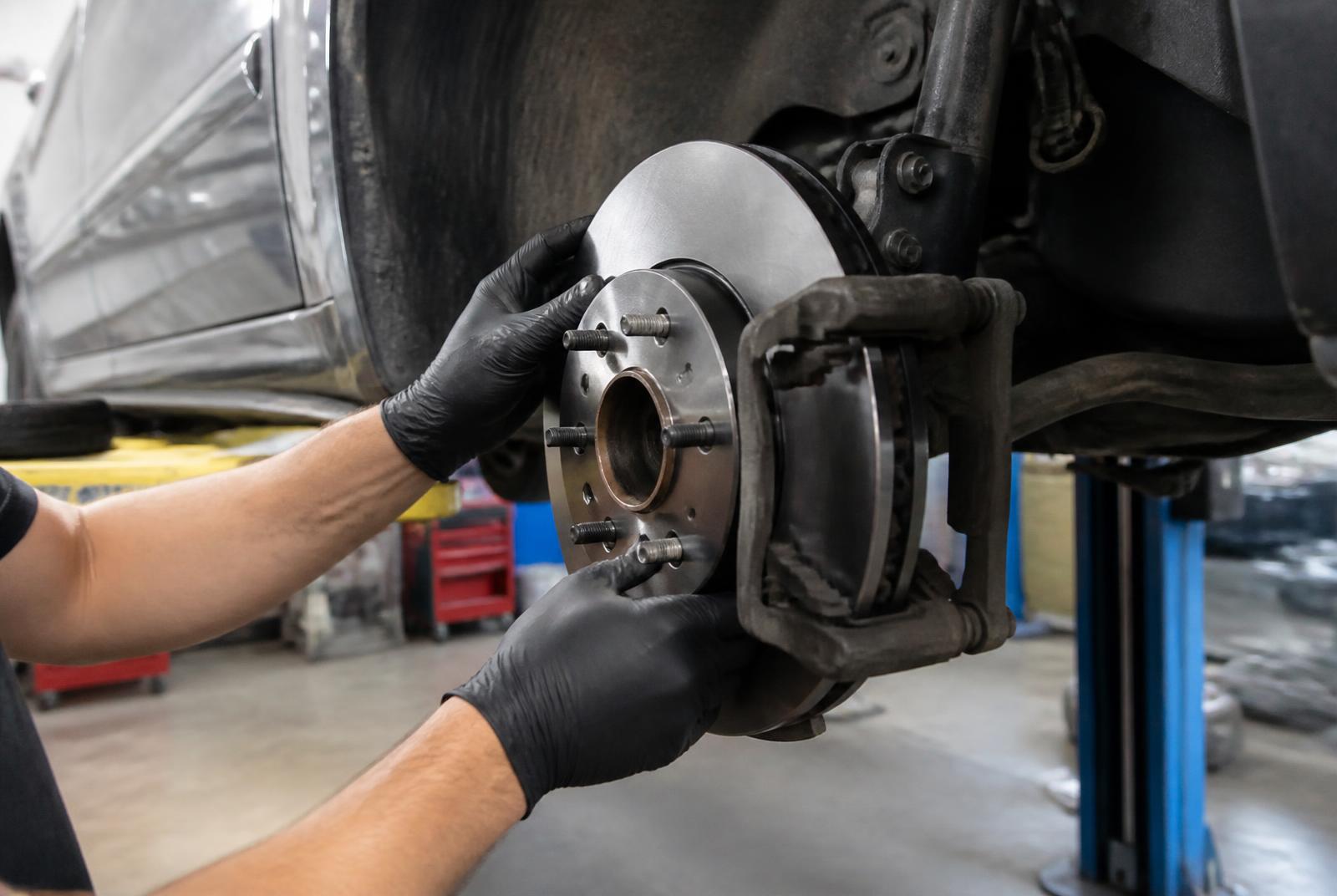 Brake pads and rotors being serviced at 4 Aces Auto Center in Peterborough, Ontario